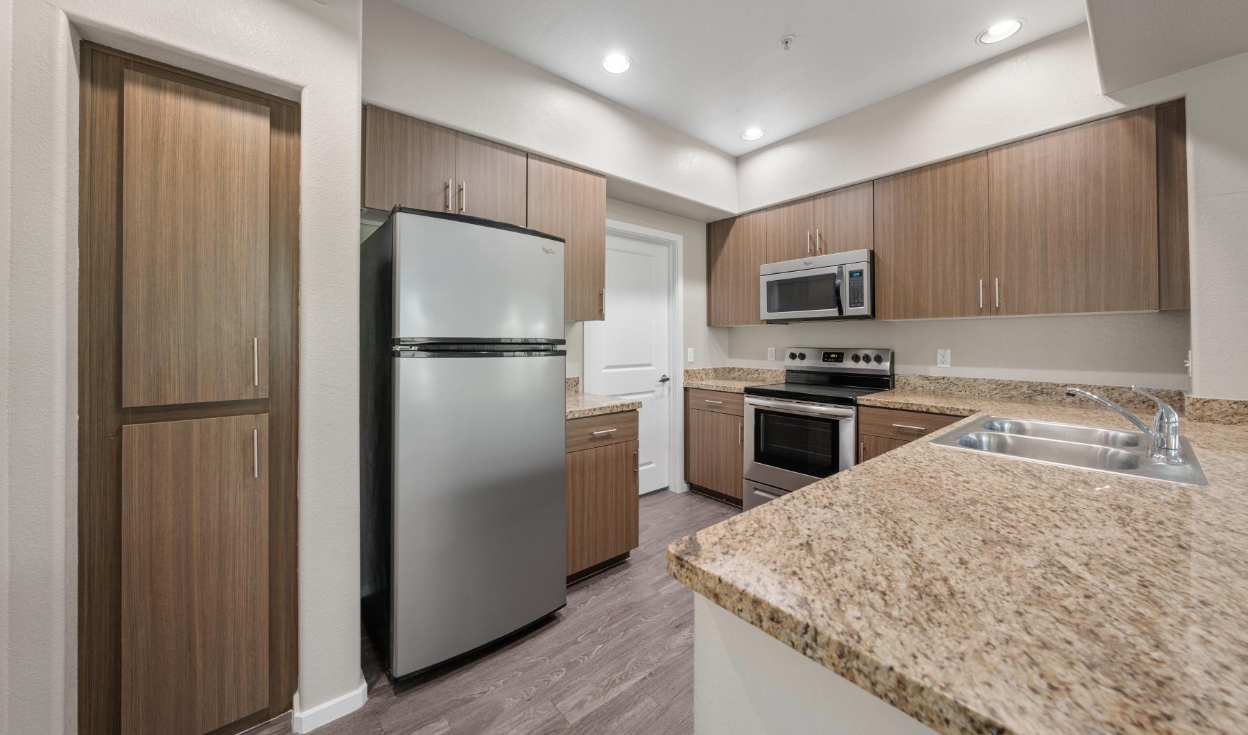 Spacious kitchens with thoughtful details a kitchen with wooden cabinets