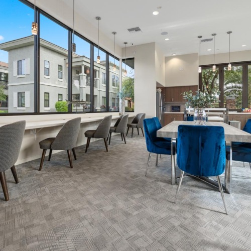 Settle into comfort at Indigo Apartments a room with a table and chairs