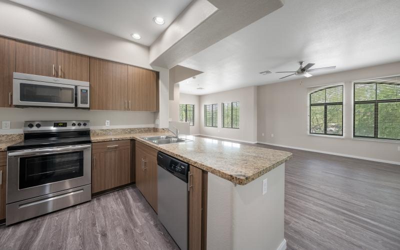 a kitchen with wooden cabinets