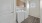 a laundry room with brown cabinets