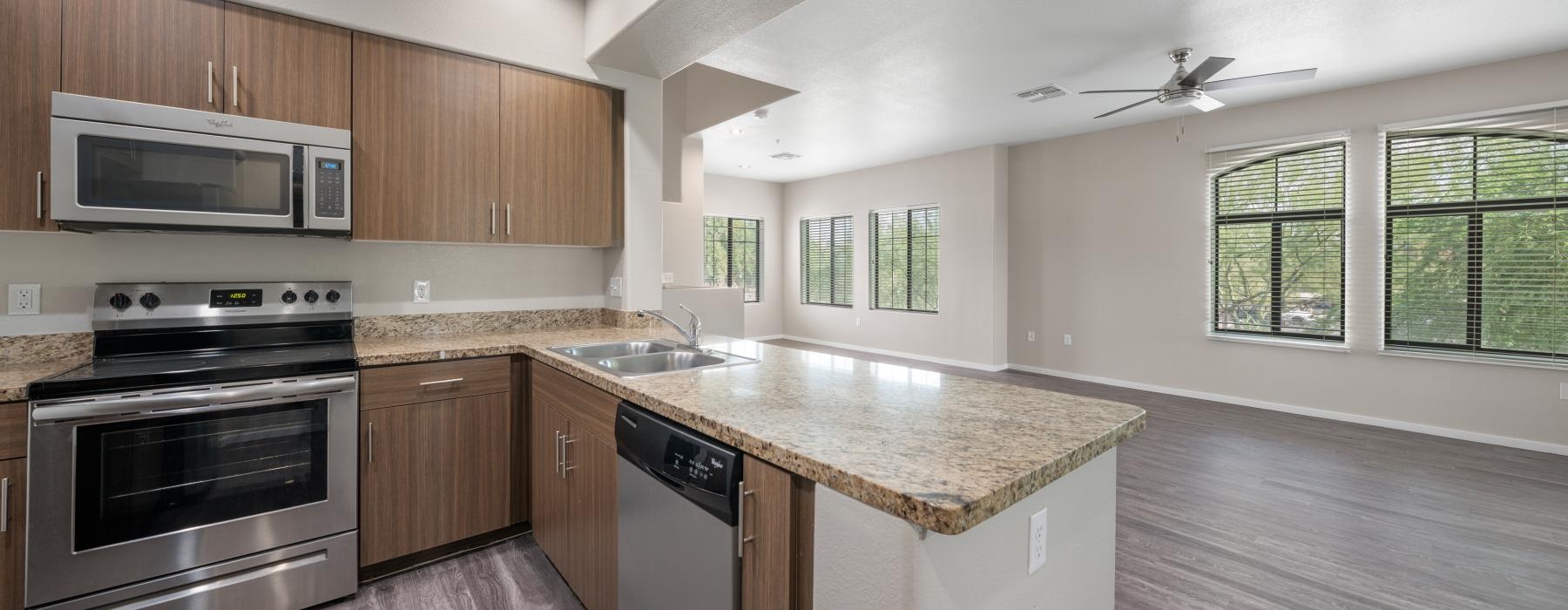 a kitchen with wooden cabinets