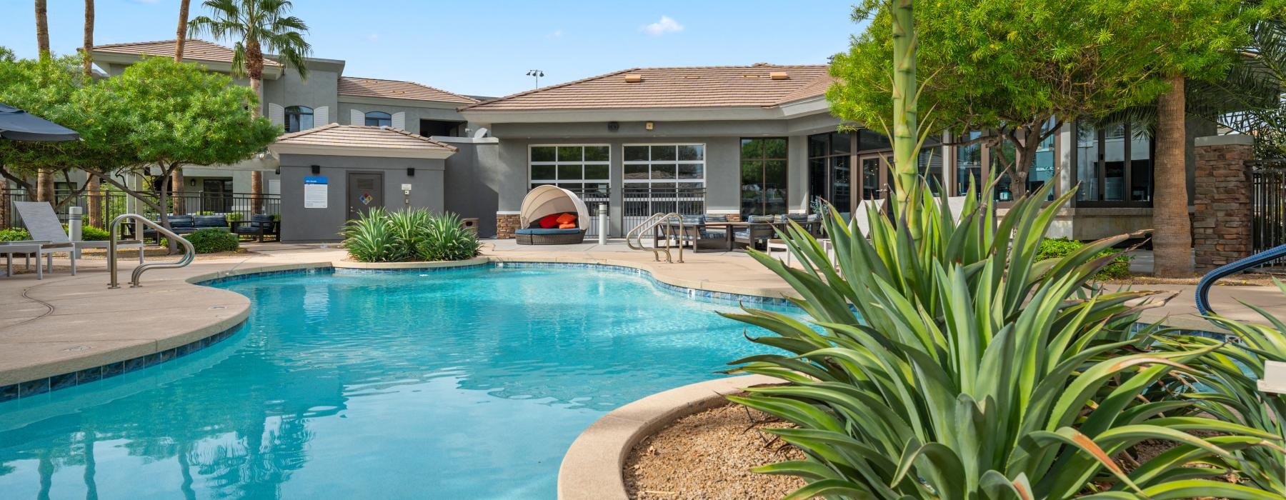 a swimming pool in front of a house